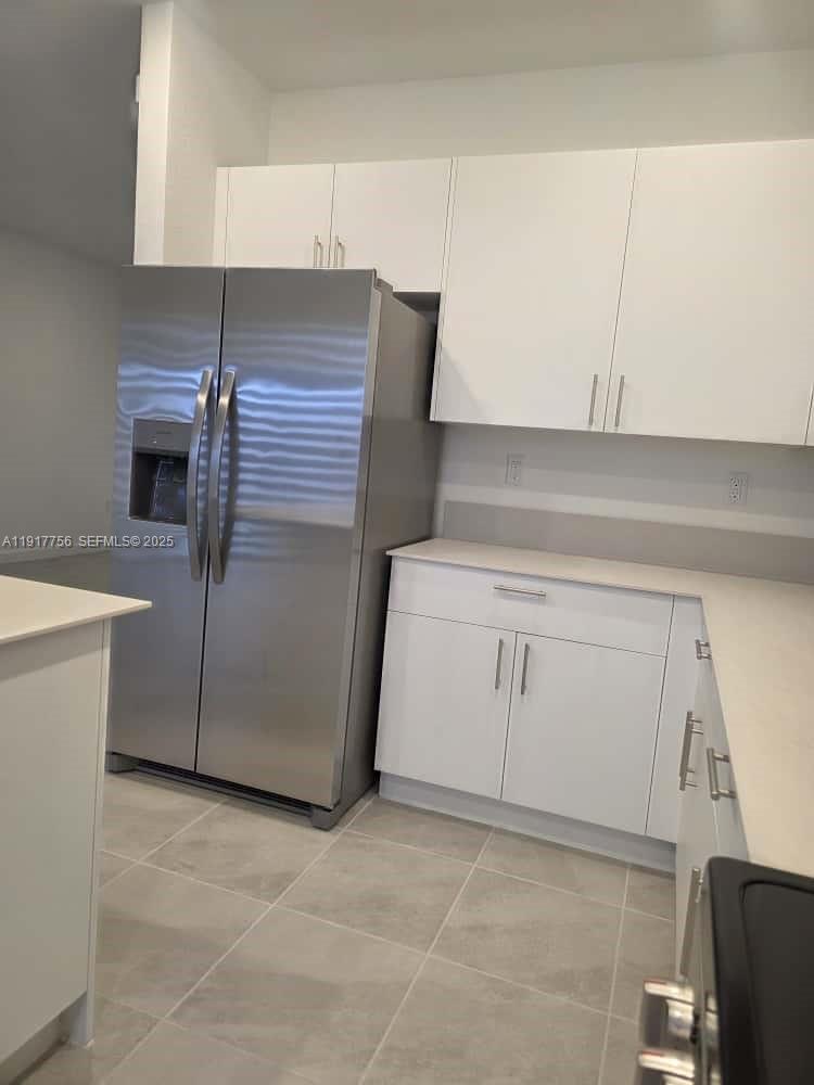 17875 Southwest 359 Terrace Homestead, FL 33034 - Photo 7 of 20 a kitchen with white cabinets and white appliances