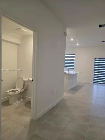 a view of a bathroom with a toilet
