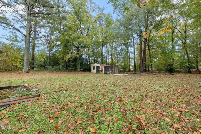a backyard of a house with lots of green space