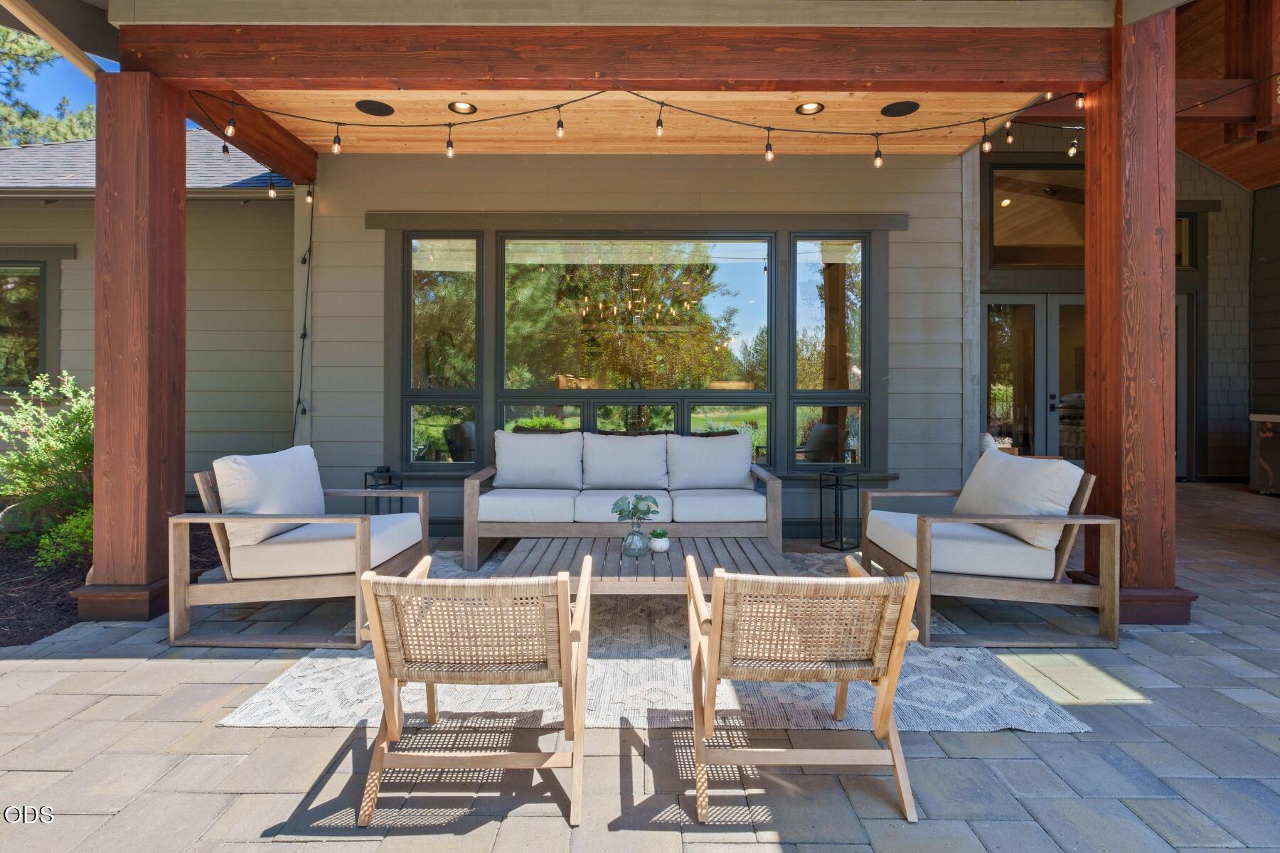 60255 Sunset View Drive Bend, OR 97702 - Photo 40 of 48 a outdoor space with patio the couches and a dining table with garden view