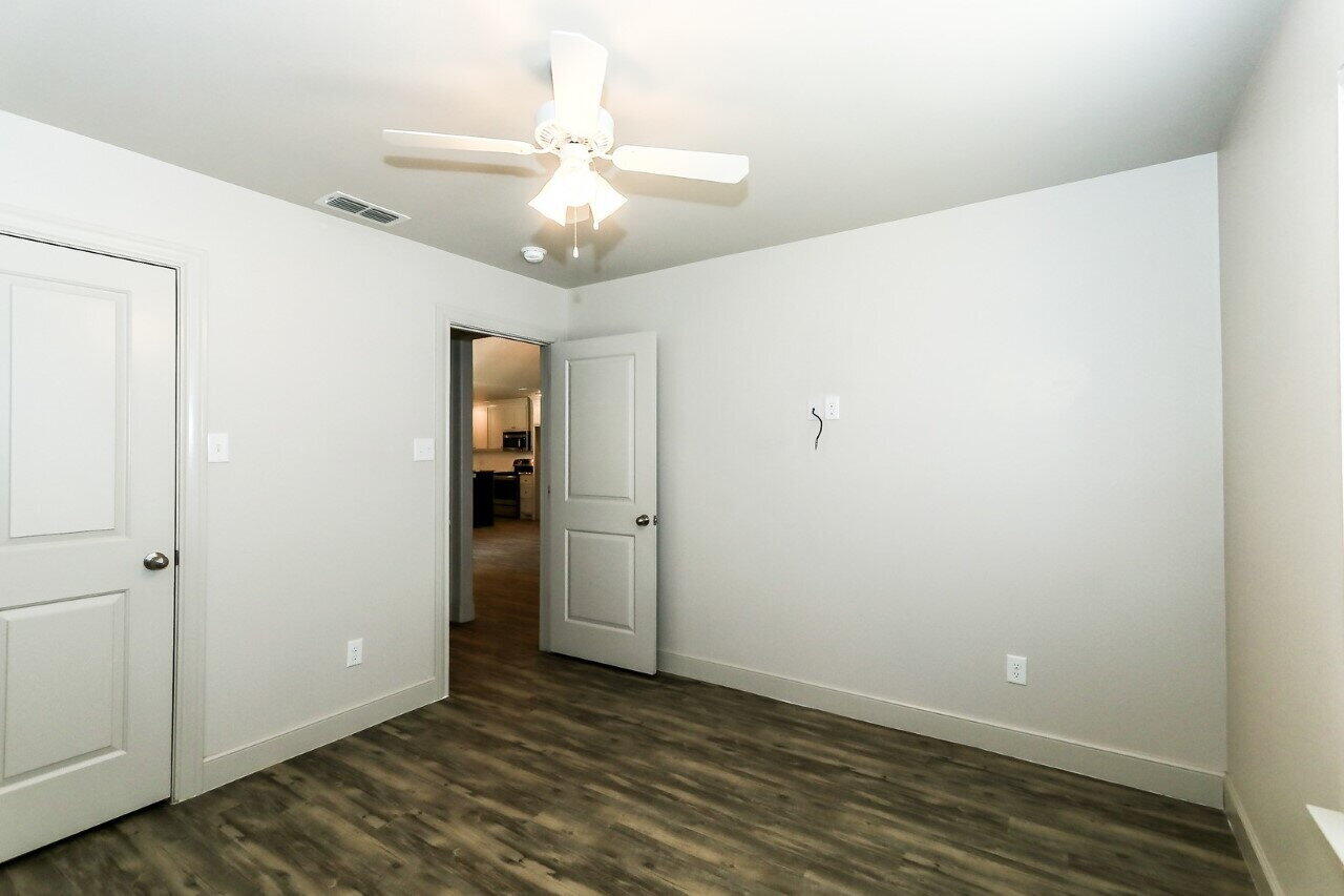 3814 133rd Street, Unit B Lubbock, TX 79423 - Photo 7 of 13 wooden floor in an empty room