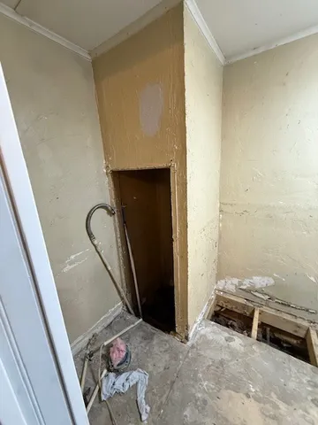 a bedroom with bed and a window