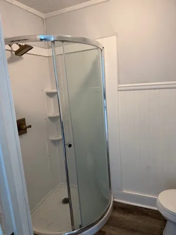 a view of a white house with a yard