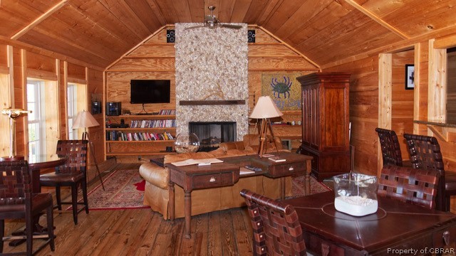 1167 Johns Neck Road Weems, VA 22576 - Photo 19 of 48 a living room with furniture and a fireplace