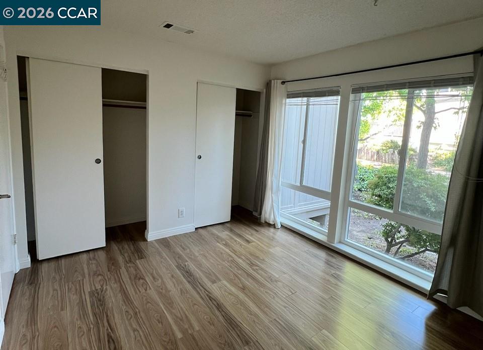 438 Ridgeview Drive Pleasant Hill, CA 94523 - Photo 7 of 12 a view of a room with wooden floor and door