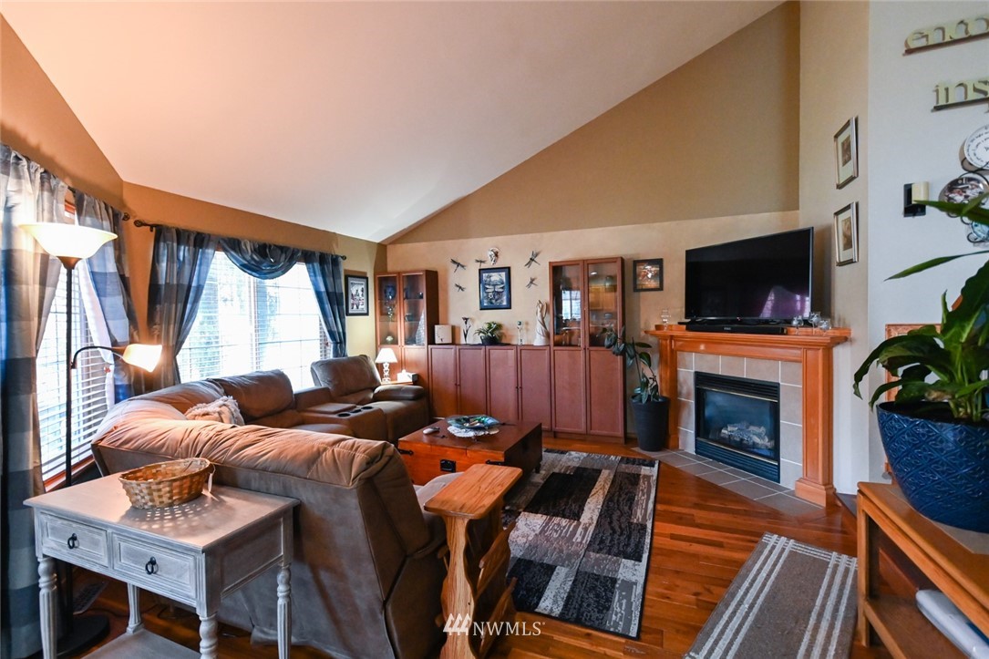 1018 Gohr Road Sultan, WA 98294 - Photo 3 of 16 a living room with furniture fireplace and flat screen tv