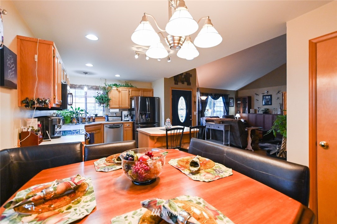 1018 Gohr Road Sultan, WA 98294 - Photo 7 of 16 a living room with lots of furniture and a chandelier