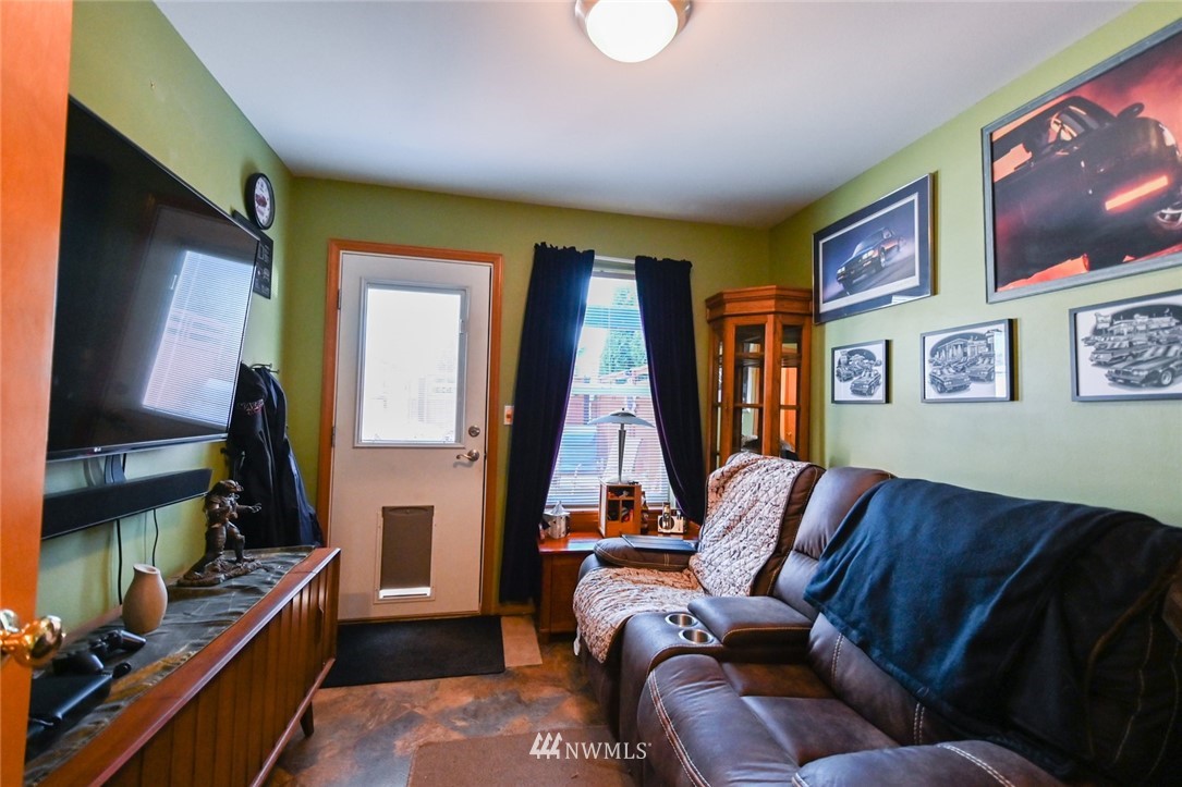 1018 Gohr Road Sultan, WA 98294 - Photo 8 of 16 a living room with furniture and a flat screen tv