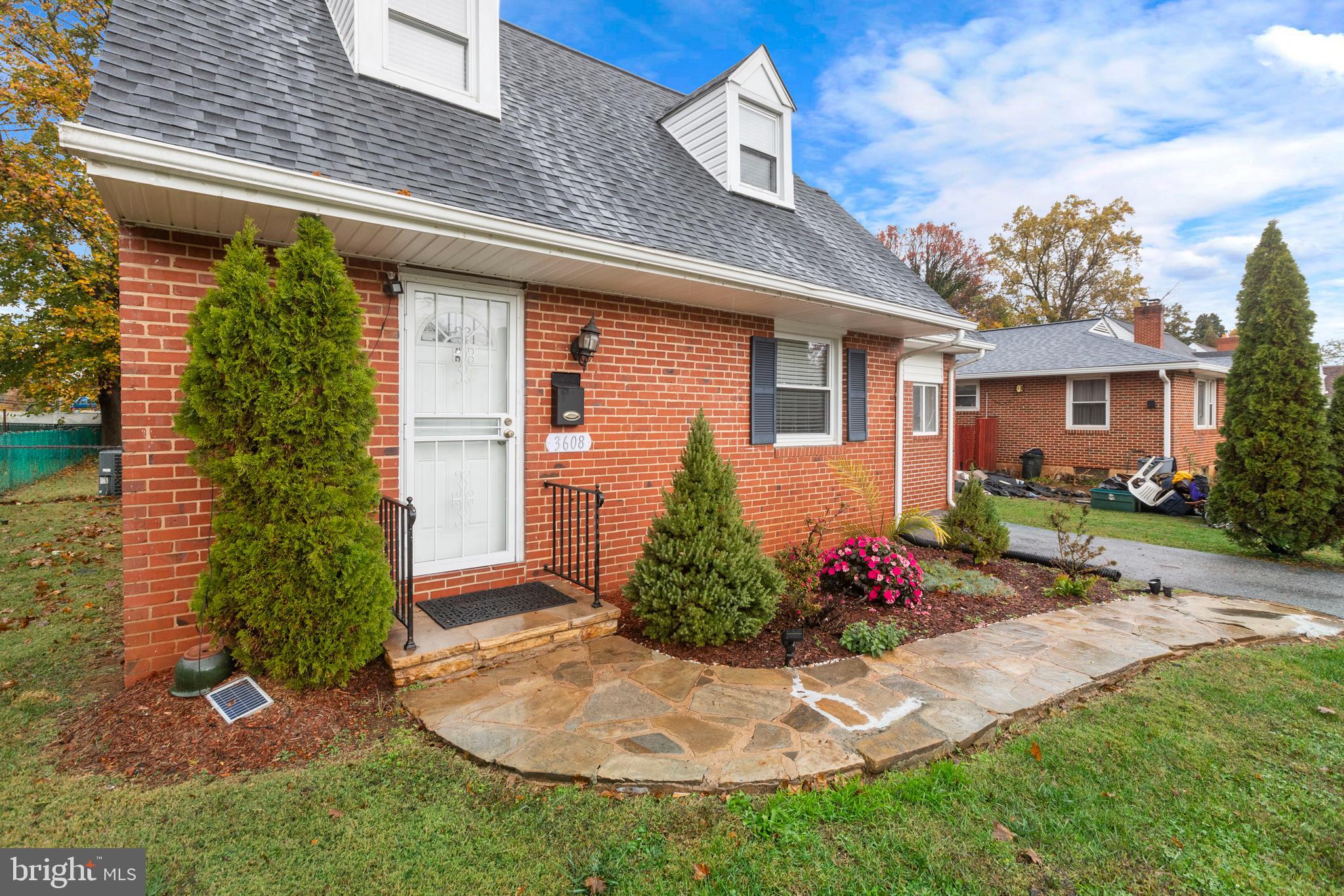 3608 Kenmar Road Baltimore, MD 21244 - Photo 3 of 46 a front view of a house with a yard