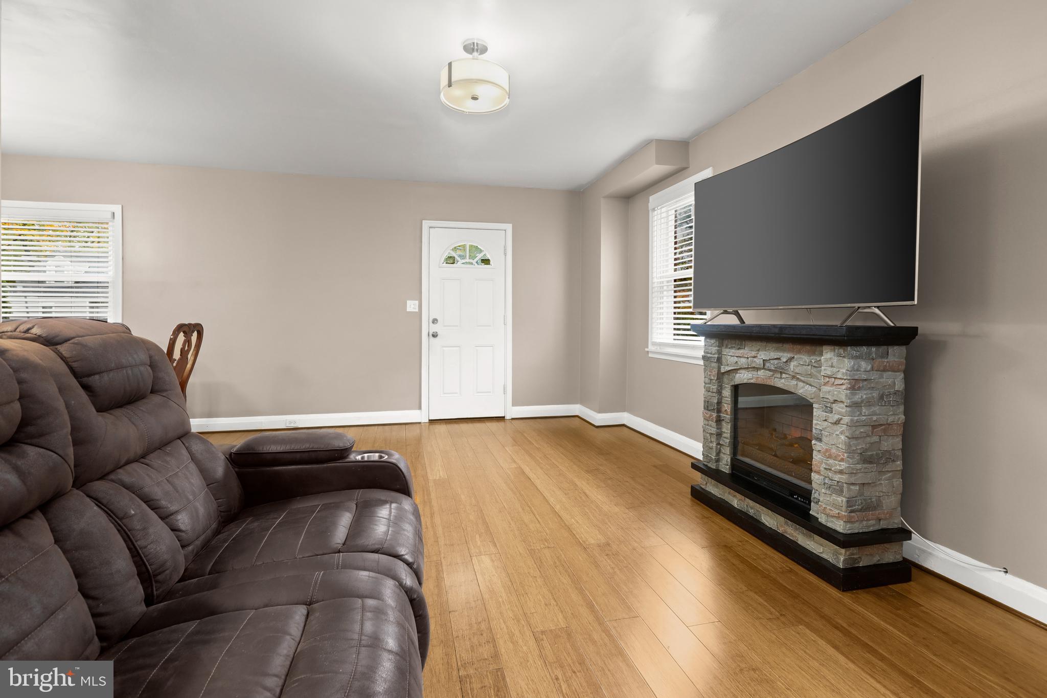 3608 Kenmar Road Baltimore, MD 21244 - Photo 8 of 46 a living room with furniture and a flat screen tv