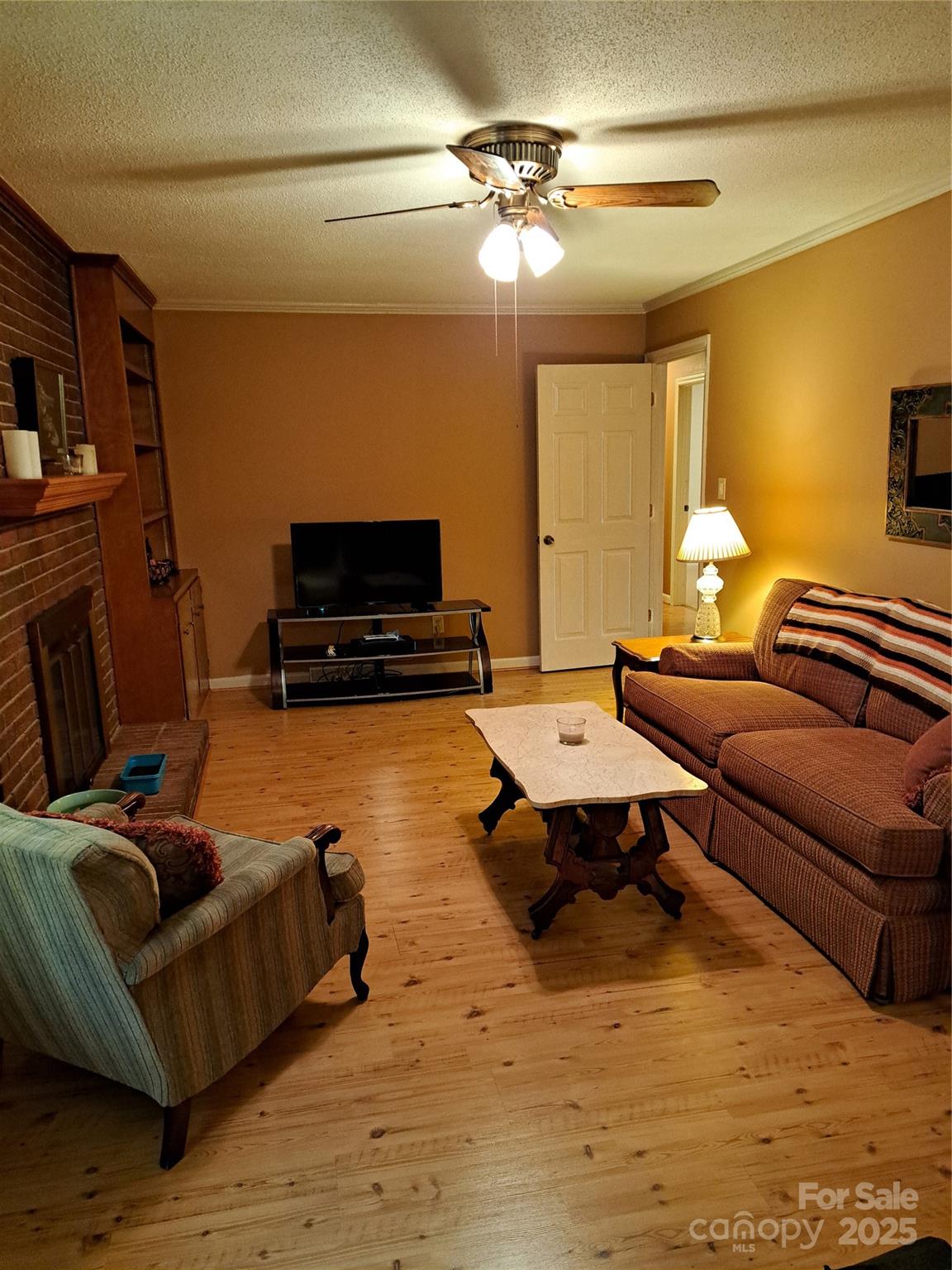 123 Softwind Lane Concord, NC 28025 - Photo 13 of 42 a living room with furniture and a flat screen tv
