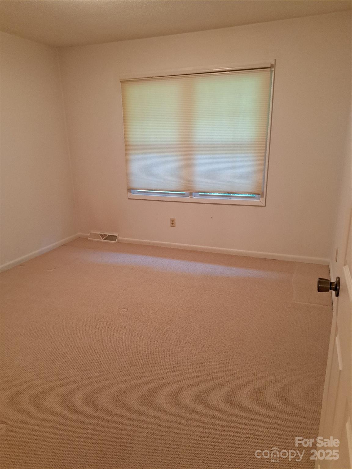 123 Softwind Lane Concord, NC 28025 - Photo 17 of 42 a view of an empty room with a window