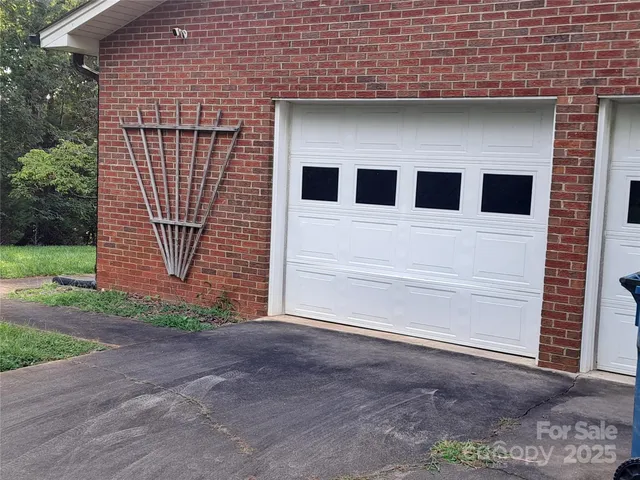 a front view of house with yard and trees