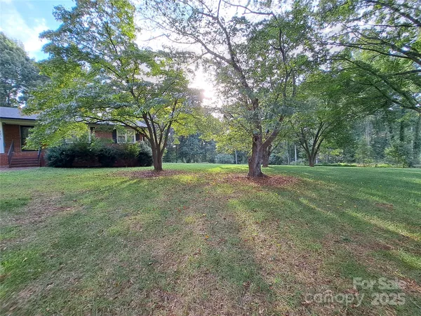 a view of outdoor space with deck and yard