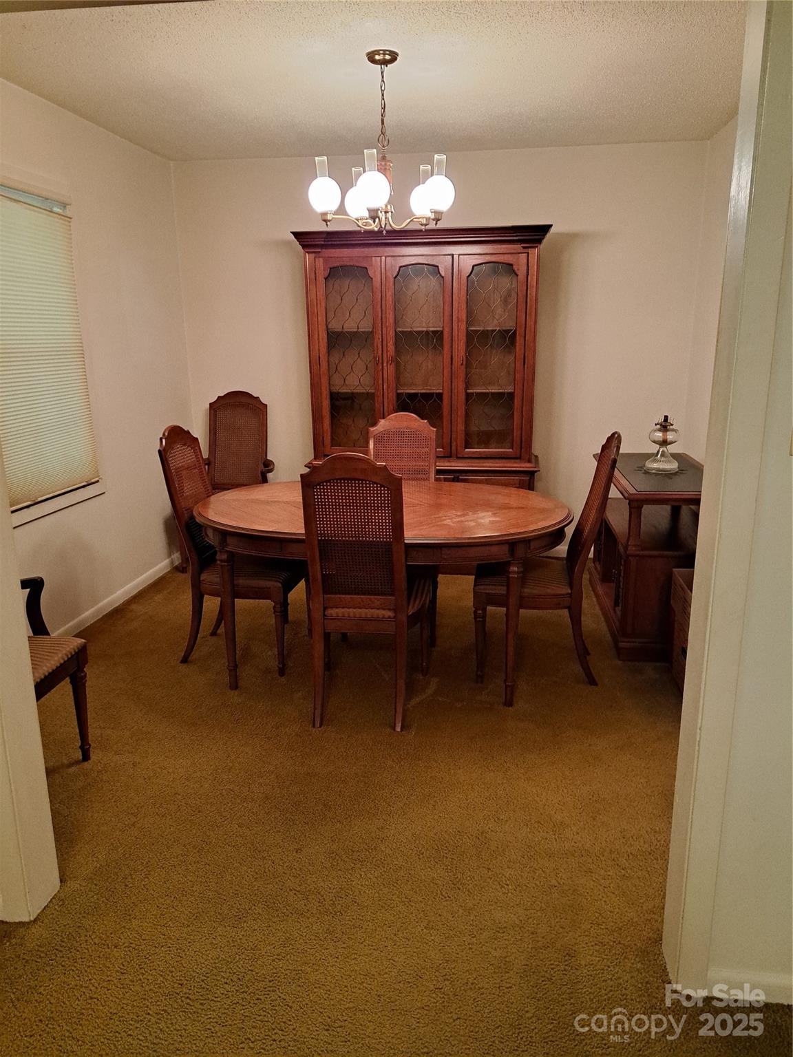123 Softwind Lane Concord, NC 28025 - Photo 6 of 42 a dining room with furniture and chandelier