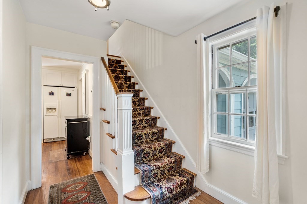 9 Damien Road Wellesley, MA 02481 - Photo 11 of 39 a view of a hallway with windows and stairs