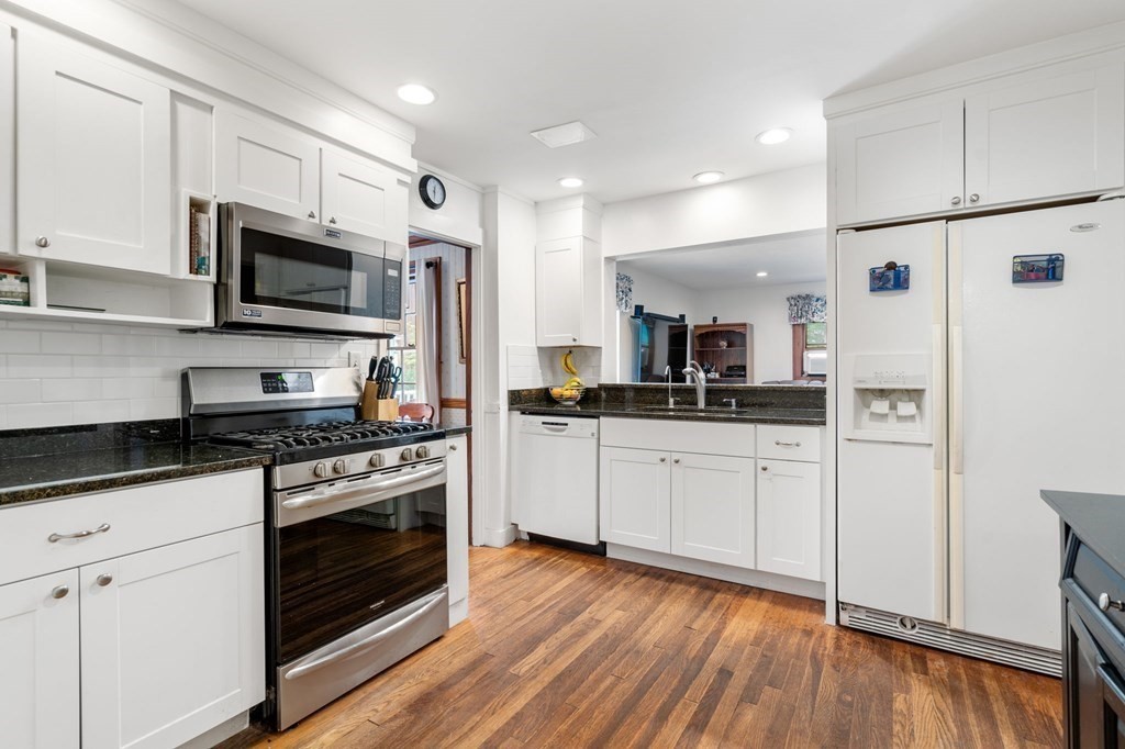 9 Damien Road Wellesley, MA 02481 - Photo 12 of 39 a kitchen with stainless steel appliances white cabinets a stove a sink and a hard wood floors