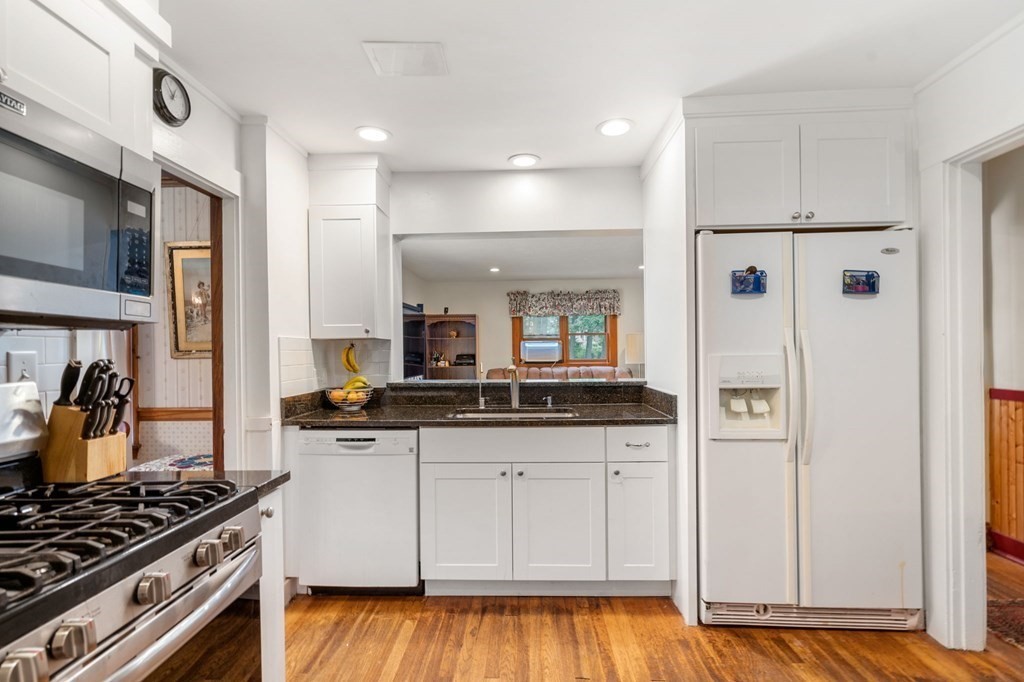 9 Damien Road Wellesley, MA 02481 - Photo 14 of 39 a kitchen with granite countertop a sink stove and refrigerator