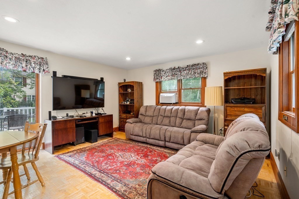 9 Damien Road Wellesley, MA 02481 - Photo 16 of 39 a living room with furniture and a flat screen tv
