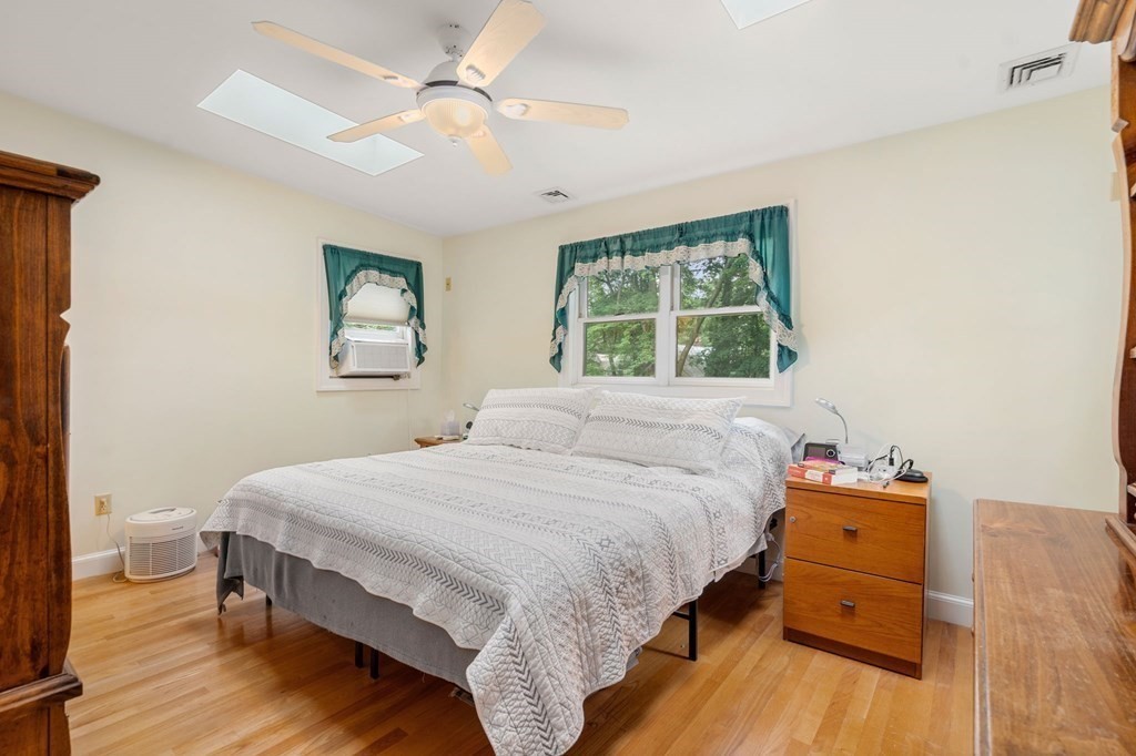 9 Damien Road Wellesley, MA 02481 - Photo 19 of 39 a bedroom with a bed and a tv on the dresser