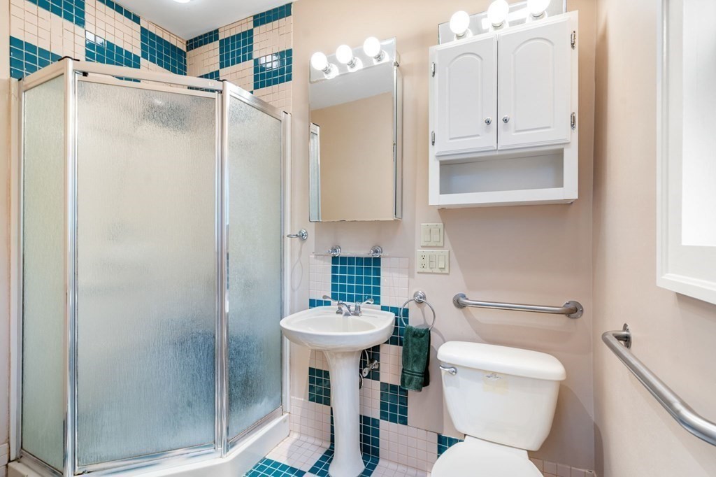 9 Damien Road Wellesley, MA 02481 - Photo 20 of 39 a bathroom with a sink toilet and shower