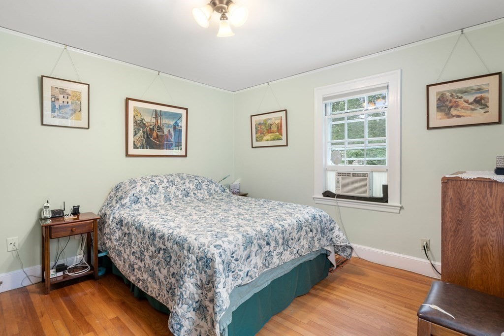 9 Damien Road Wellesley, MA 02481 - Photo 23 of 39 a bedroom with a bed and wooden floor