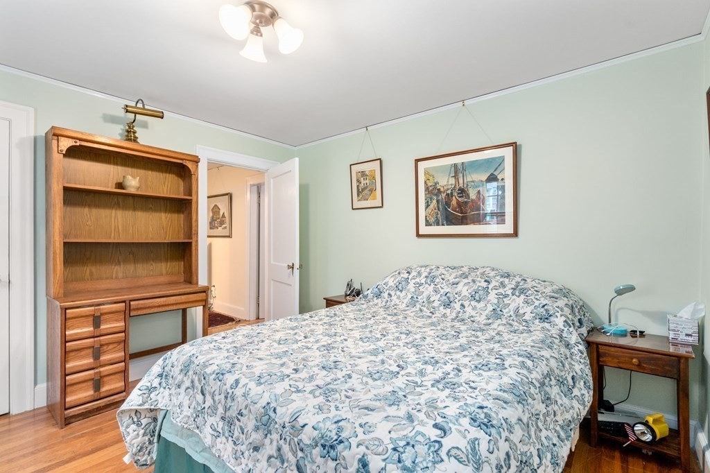 9 Damien Road Wellesley, MA 02481 - Photo 24 of 39 a bedroom with a bed and wooden floor