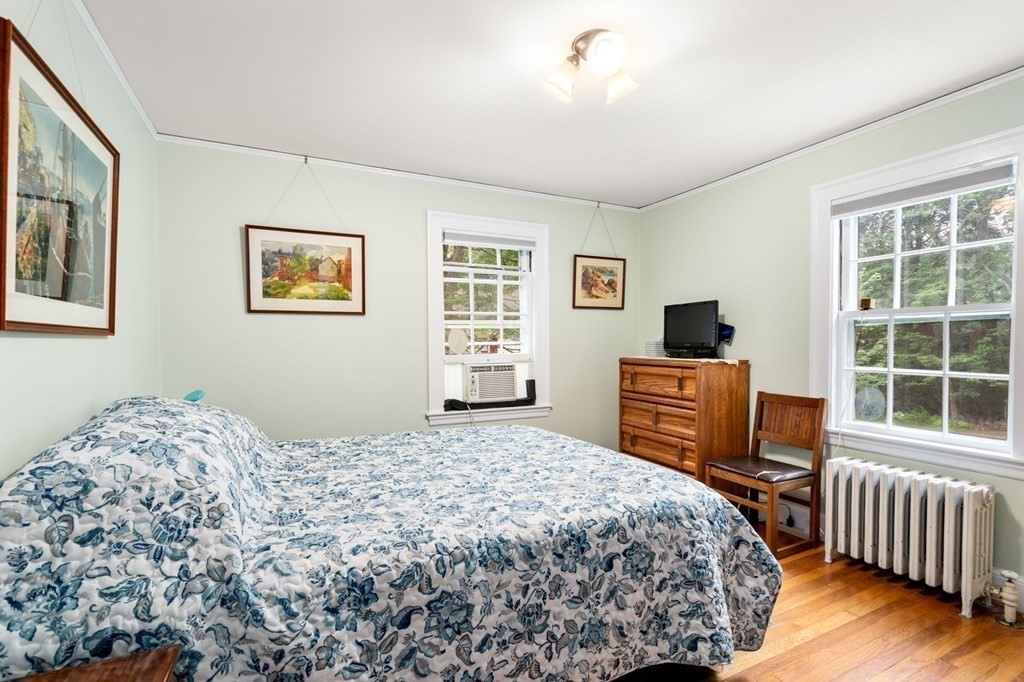 9 Damien Road Wellesley, MA 02481 - Photo 25 of 39 a bedroom with a bed and wooden floor