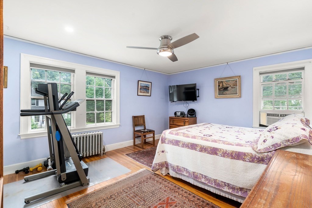 9 Damien Road Wellesley, MA 02481 - Photo 26 of 39 a bedroom with a bed chairs and a chandelier