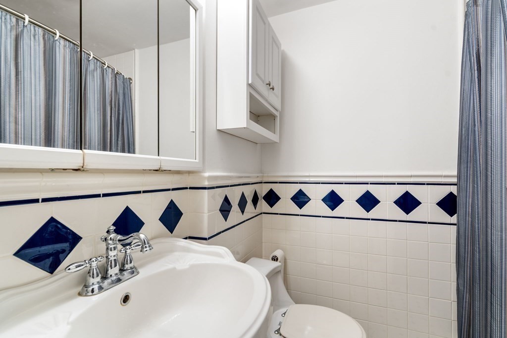 9 Damien Road Wellesley, MA 02481 - Photo 29 of 39 a bathroom with a sink and a mirror