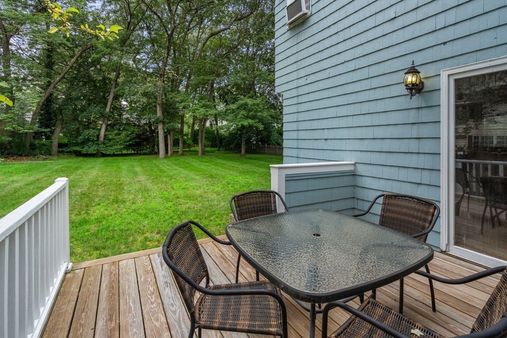 9 Damien Road Wellesley, MA 02481 - Photo 34 of 39 a backyard of a house with table and chairs