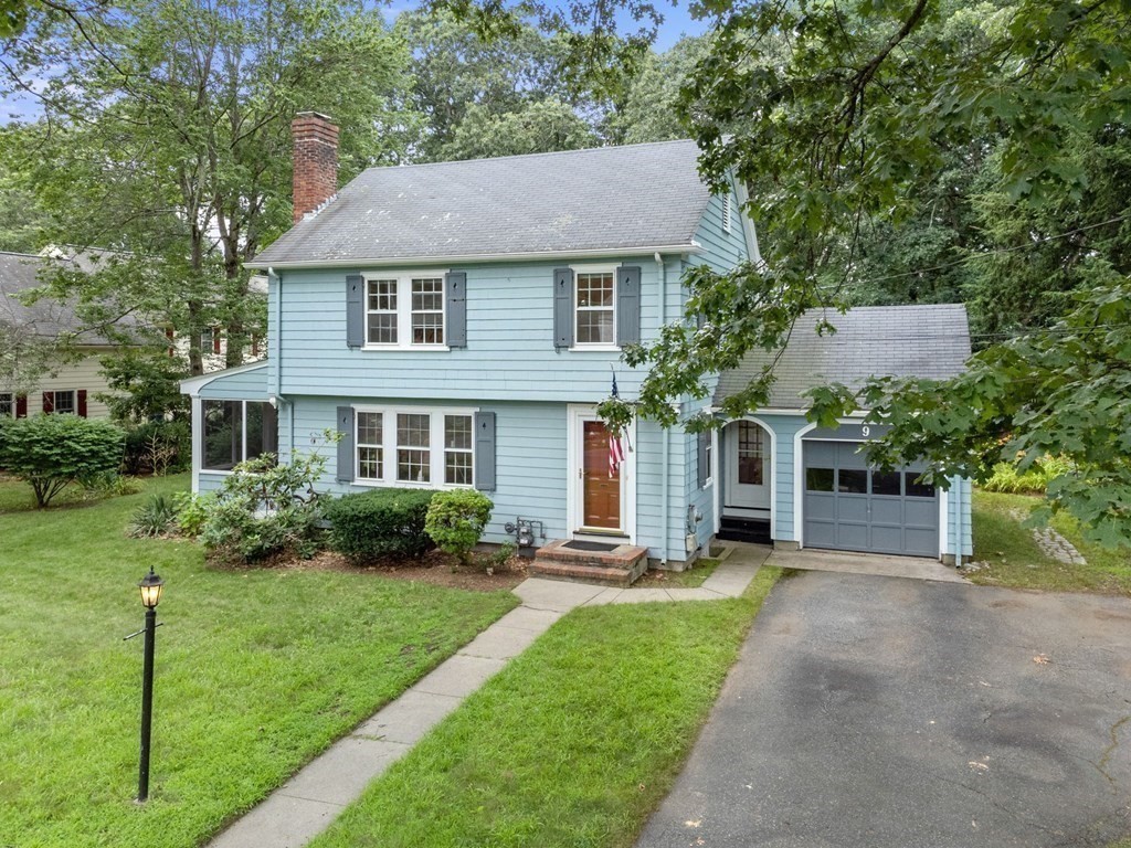 9 Damien Road Wellesley, MA 02481 - Photo 4 of 39 a front view of a house with a yard and trees