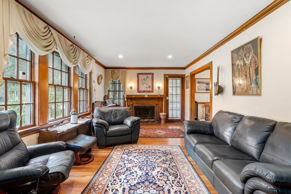 9 Damien Road Wellesley, MA 02481 - Photo 5 of 39 a living room with furniture fireplace and a large window