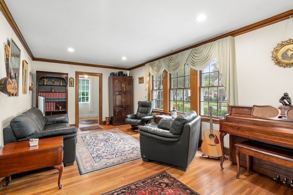 9 Damien Road Wellesley, MA 02481 - Photo 6 of 39 a living room with furniture and a floor to ceiling window