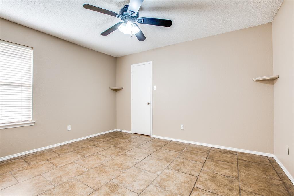 14 Enchanted Court Mansfield, TX 76063 - Photo 20 of 25 an empty room with windows and fan