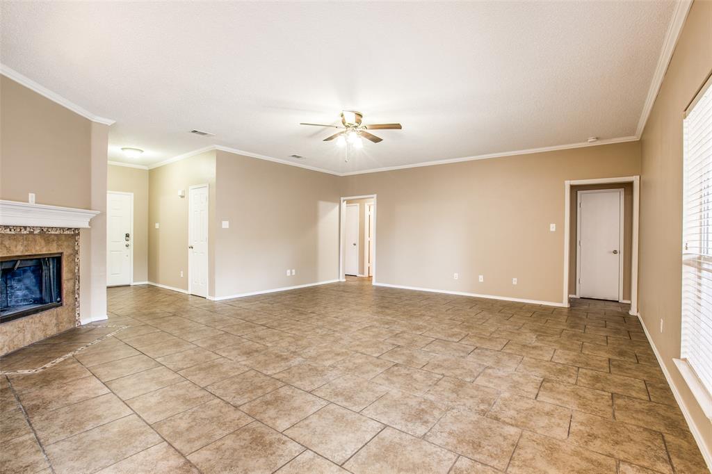 14 Enchanted Court Mansfield, TX 76063 - Photo 4 of 25 a view of an empty room with a fireplace