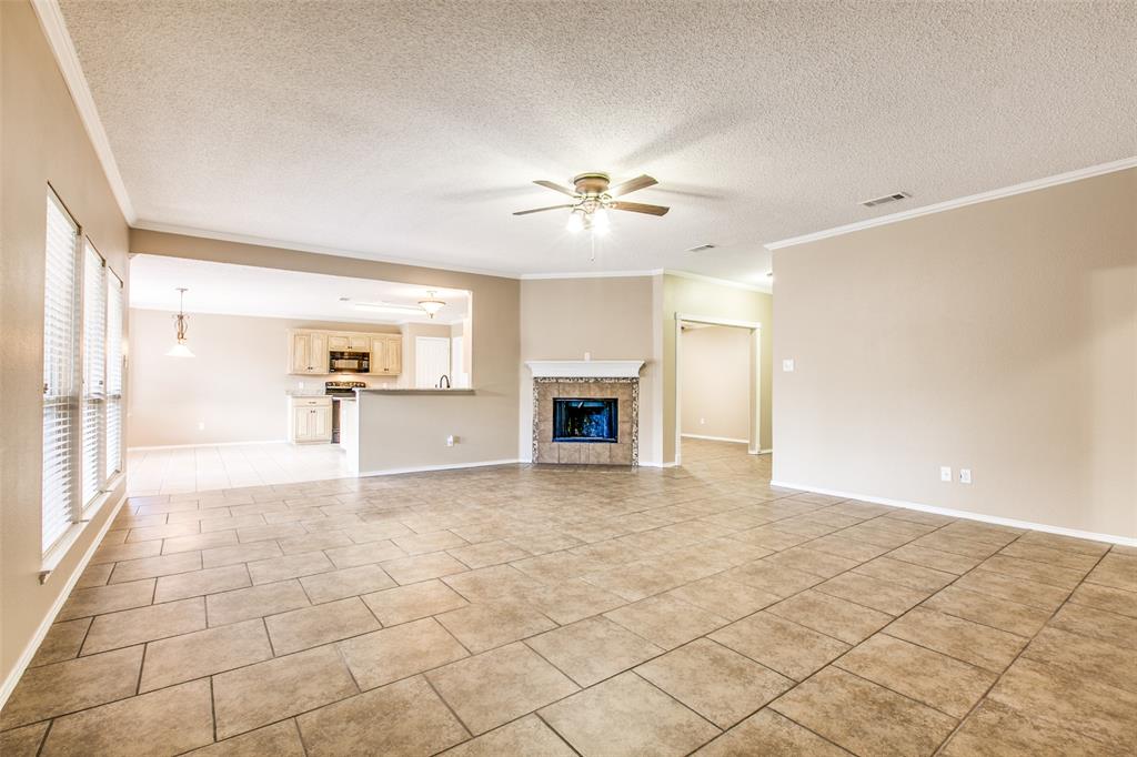 14 Enchanted Court Mansfield, TX 76063 - Photo 7 of 25 a view of a big room with windows and fireplace