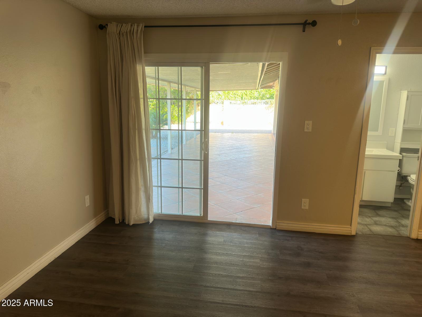 7728 North 47th Drive Glendale, AZ 85301 - Photo 12 of 23 a view of wooden floor and windows in a room