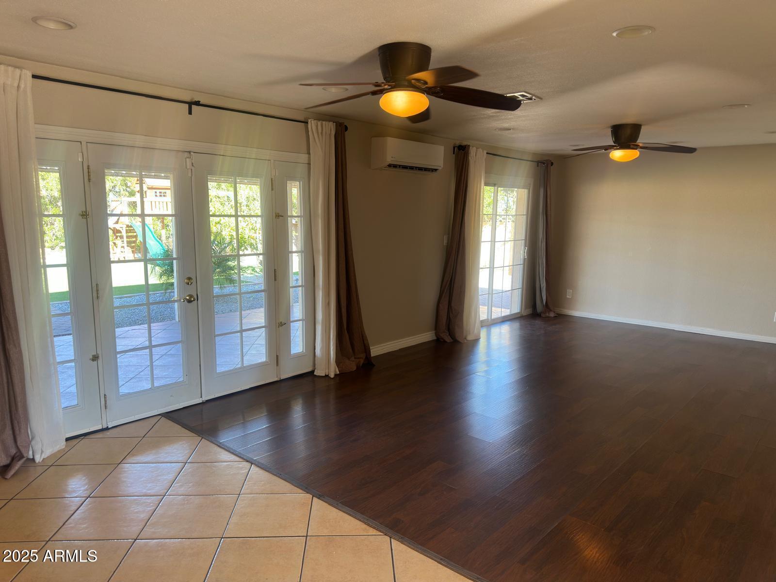 7728 North 47th Drive Glendale, AZ 85301 - Photo 19 of 23 a view of an empty room with window and wooden floor