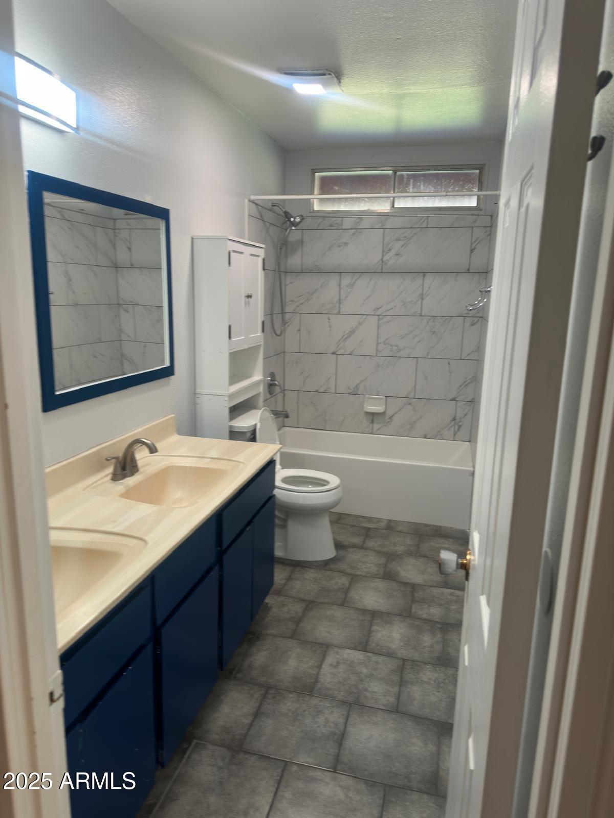 7728 North 47th Drive Glendale, AZ 85301 - Photo 20 of 23 a bathroom with a sink a toilet and shower