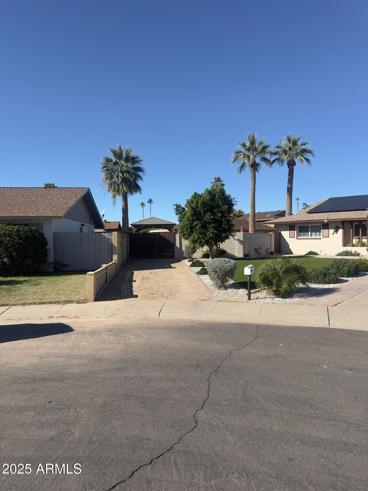 7728 North 47th Drive Glendale, AZ 85301 - Photo 4 of 23 a view of a house with a yard and potted plants