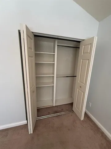 a view of an empty walk in closet