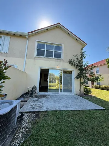 a house that has a big yard in front of it