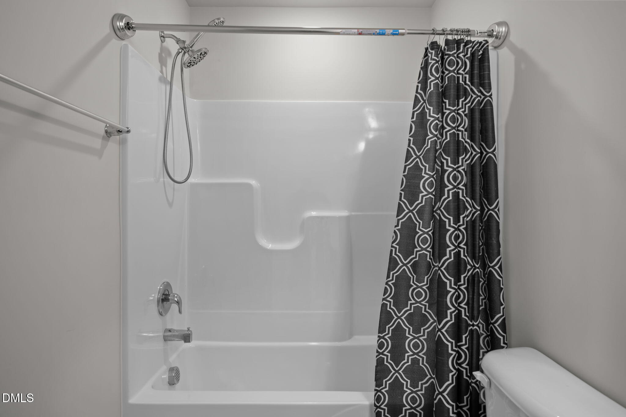 5016 Kota Street Raleigh, NC 27610 - Photo 16 of 37 a bathroom with a shower and a toilet