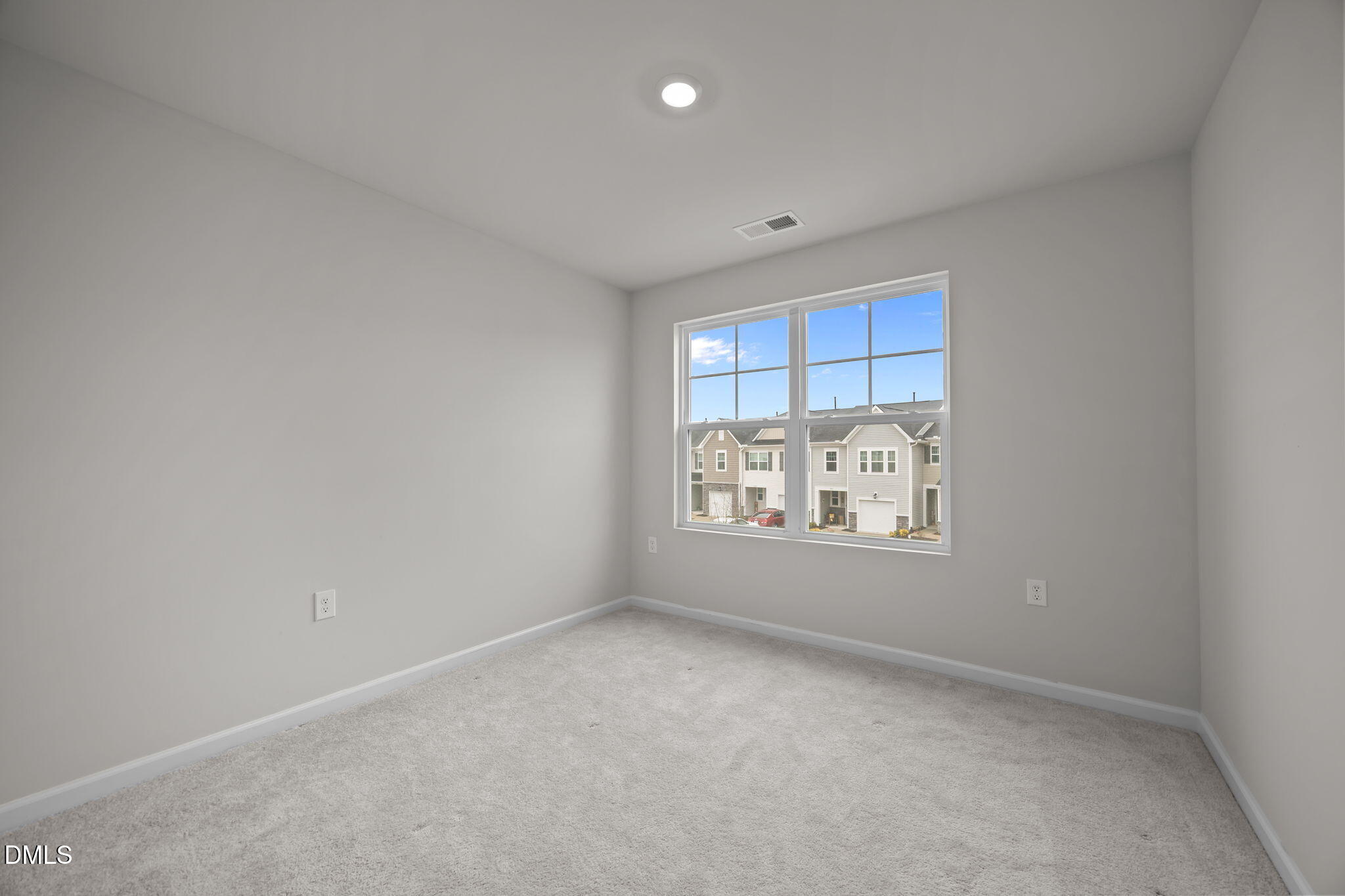 5016 Kota Street Raleigh, NC 27610 - Photo 18 of 37 a view of an empty room with a window