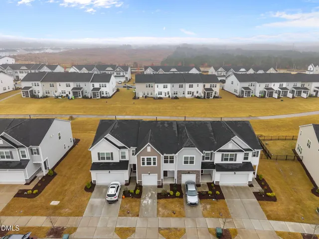 an aerial view of a house with a ocean view
