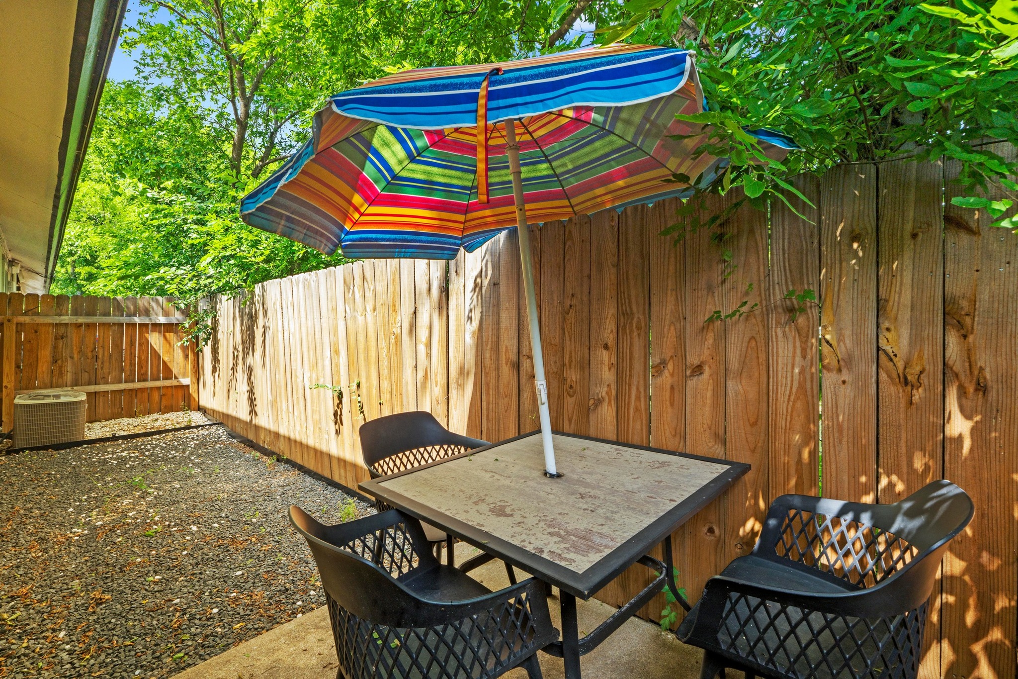 10601 Macmora Road, Unit B Austin, TX 78758 - Photo 17 of 22 A private outdoor space with a wooden fence for tranquil moments.