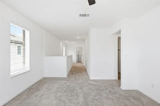 a view of a kitchen with a sink and a window
