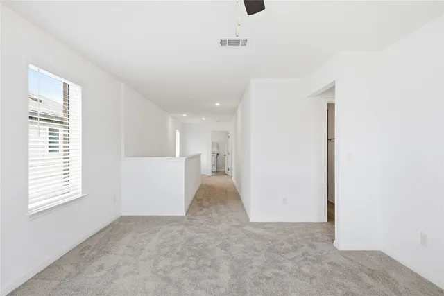 a view of a kitchen with a sink and a window