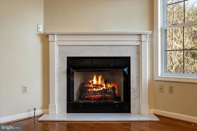 a kitchen with a sink cabinets and wooden floor